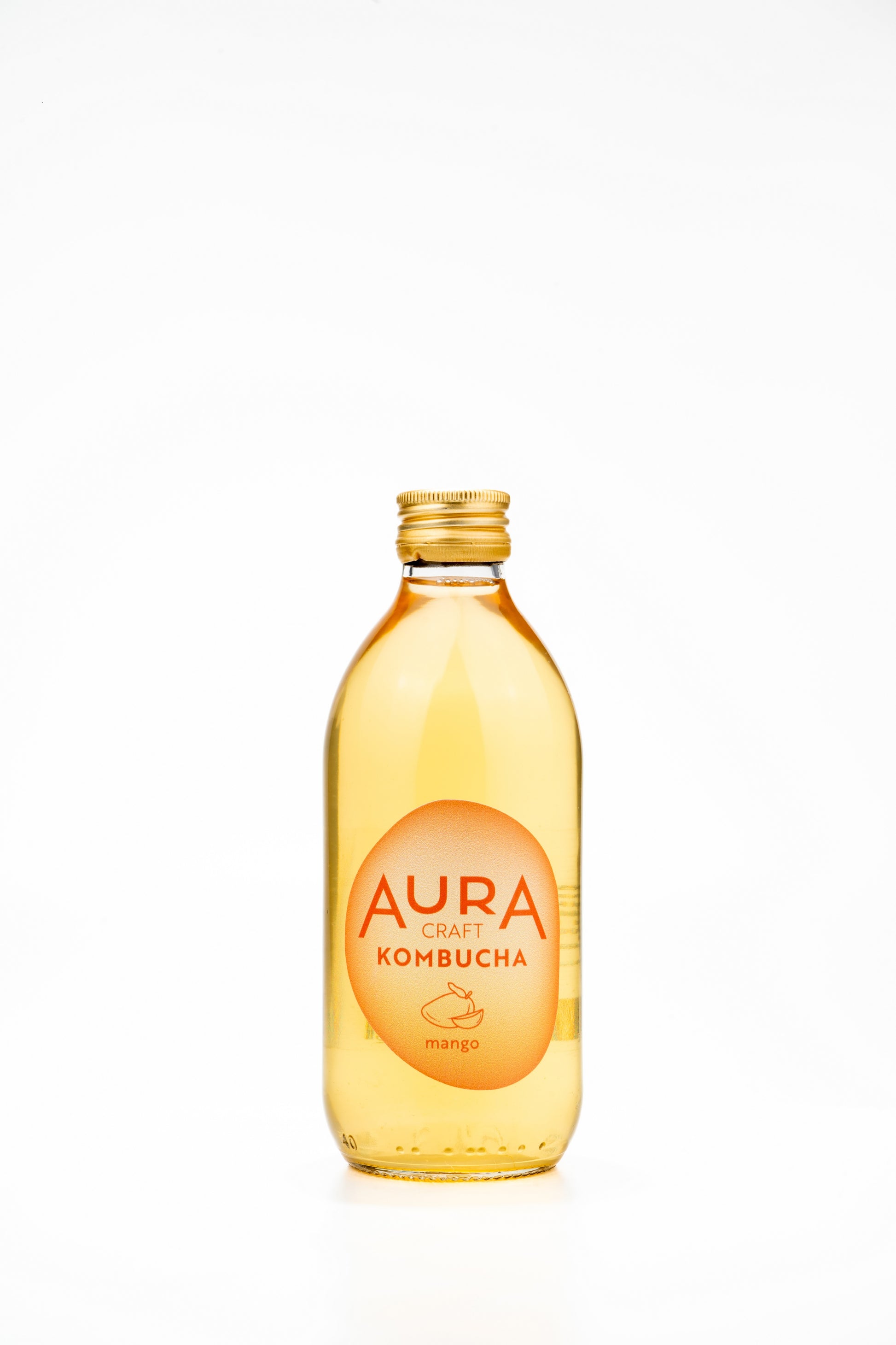 Aura Kombucha Mango – lahev 330 ml s plátkem manga